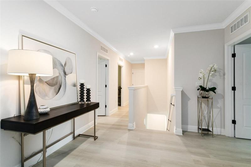 A view from the open floor plan main living area back down the foyer.