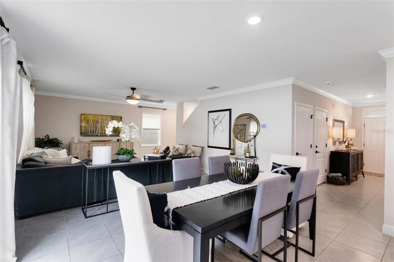 A view from the dining area into the living room. The open floor plan is IDEAL for relaxing or entertaining.