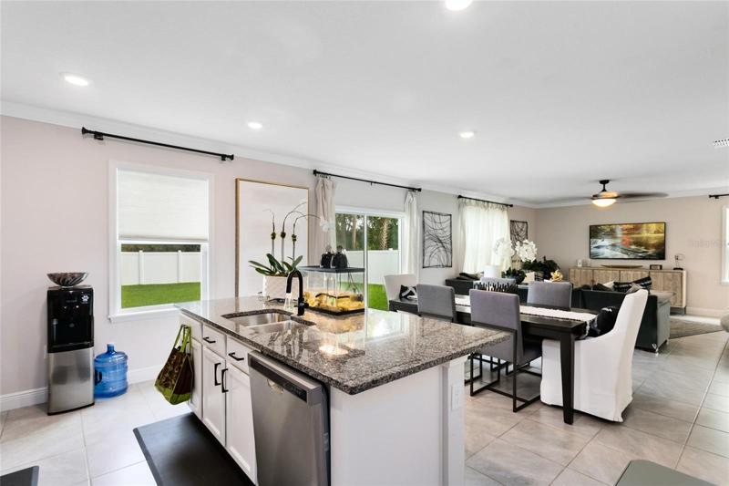 Prepare meals and gather around the granite breakfast bar for casual dining.