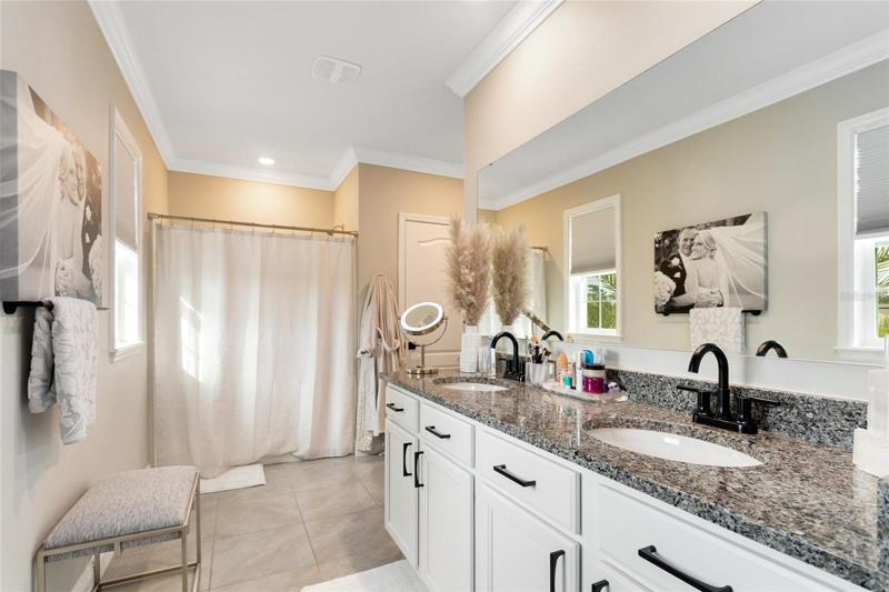 Your master bath has a dual granite topped vanity and a walk-in shower, adding a touch of luxury to your daily routine.