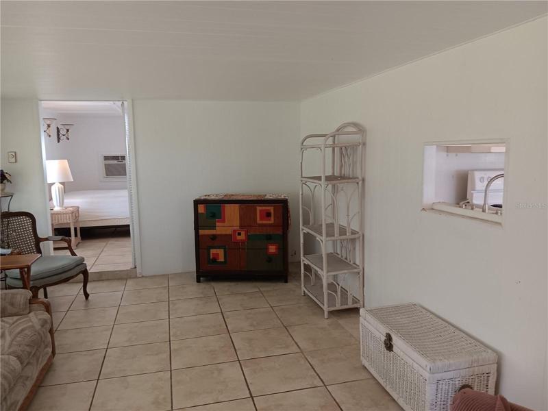 Another living rm. picture.  Plese notice the pass-through from the kitchen on the right wall !!