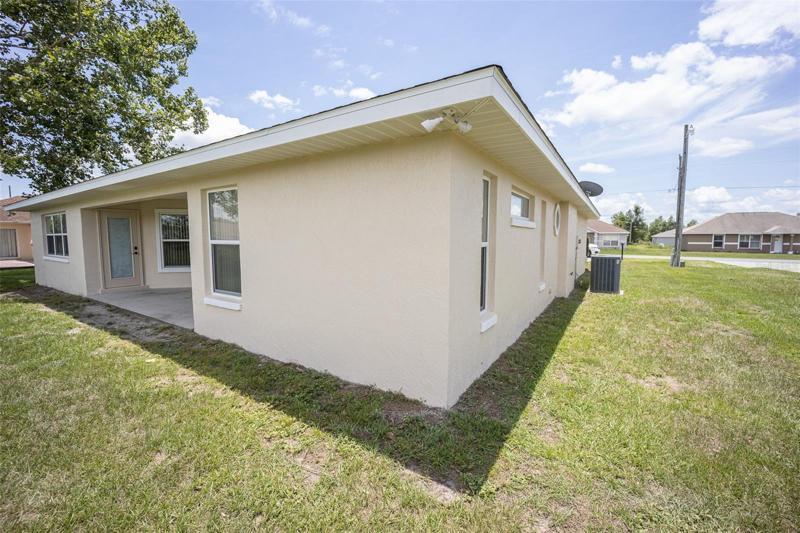 Side of home with patio view