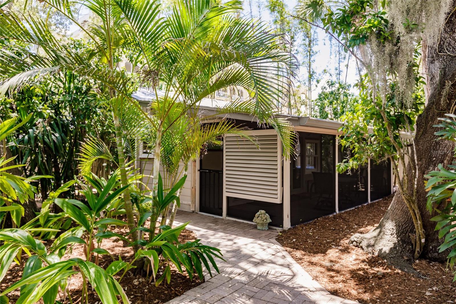 The condo is surrounded by mature landscaping for privacy and a picturesque view.