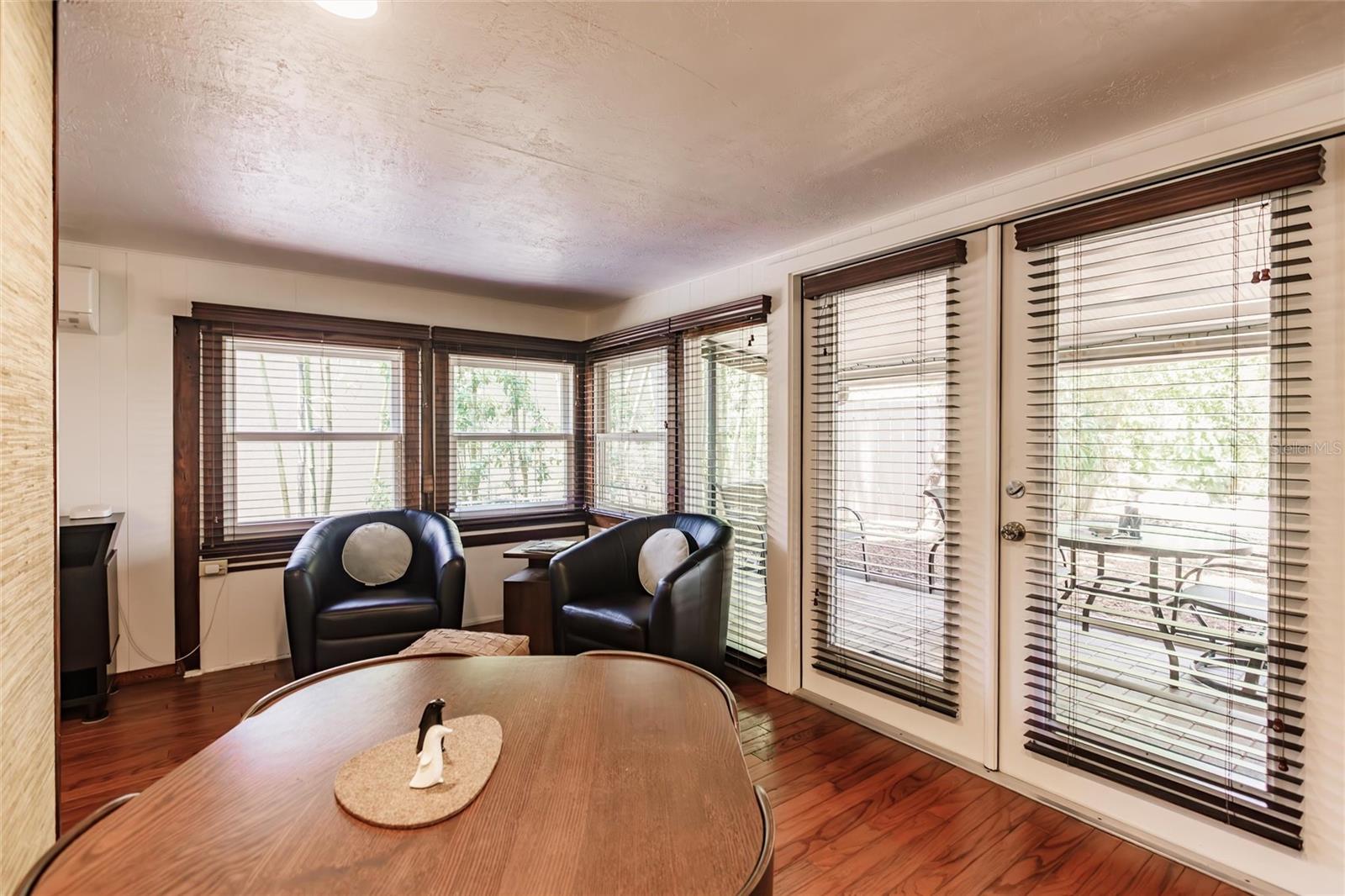 There is room for a table and chairs beside the kitchen.