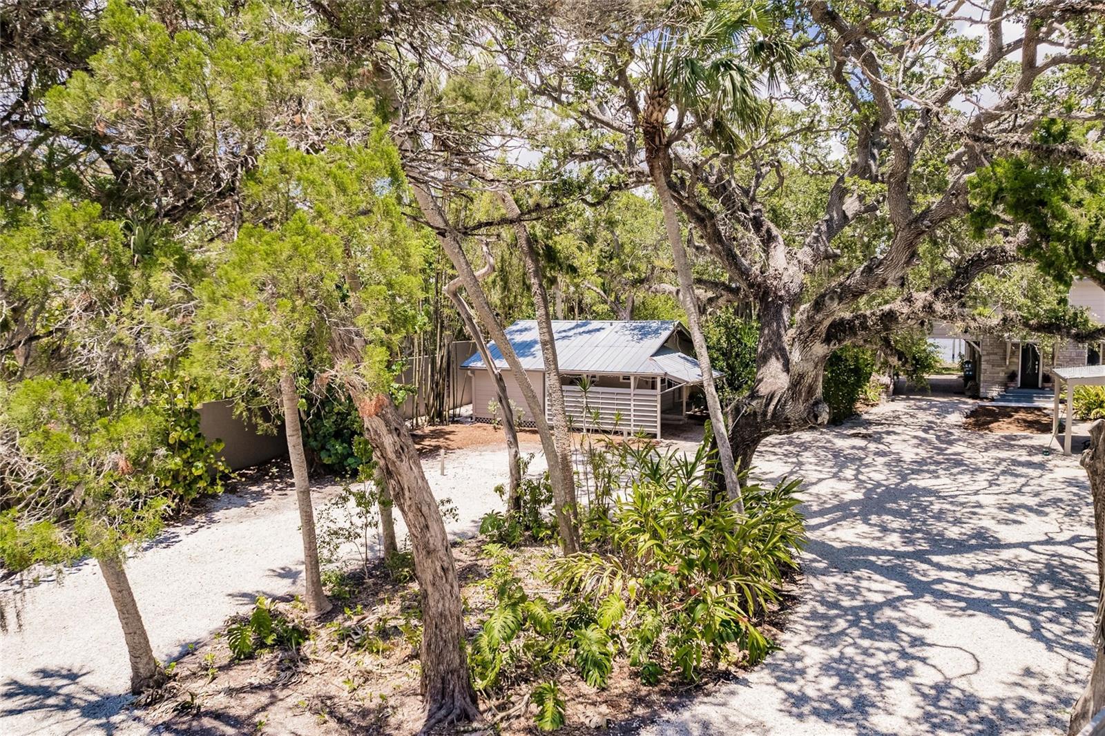 Tucked away on this wooded lot, you will have privacy from the main house.