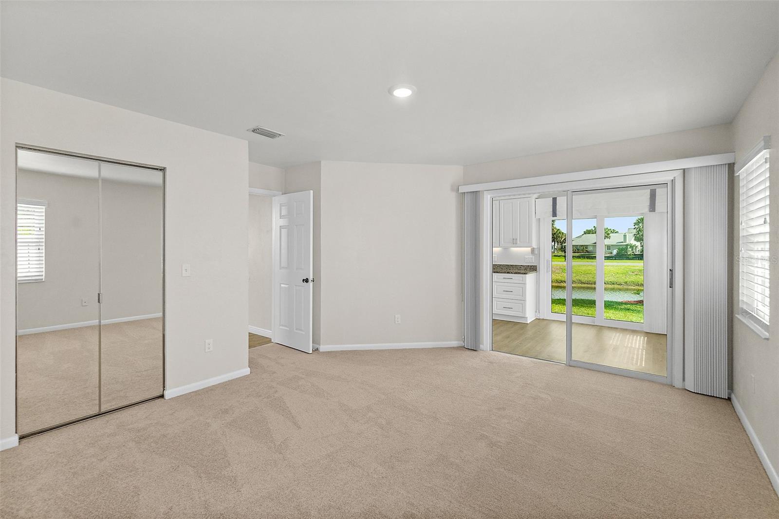 Master suite opens  into cafe- den- office area by kitchen