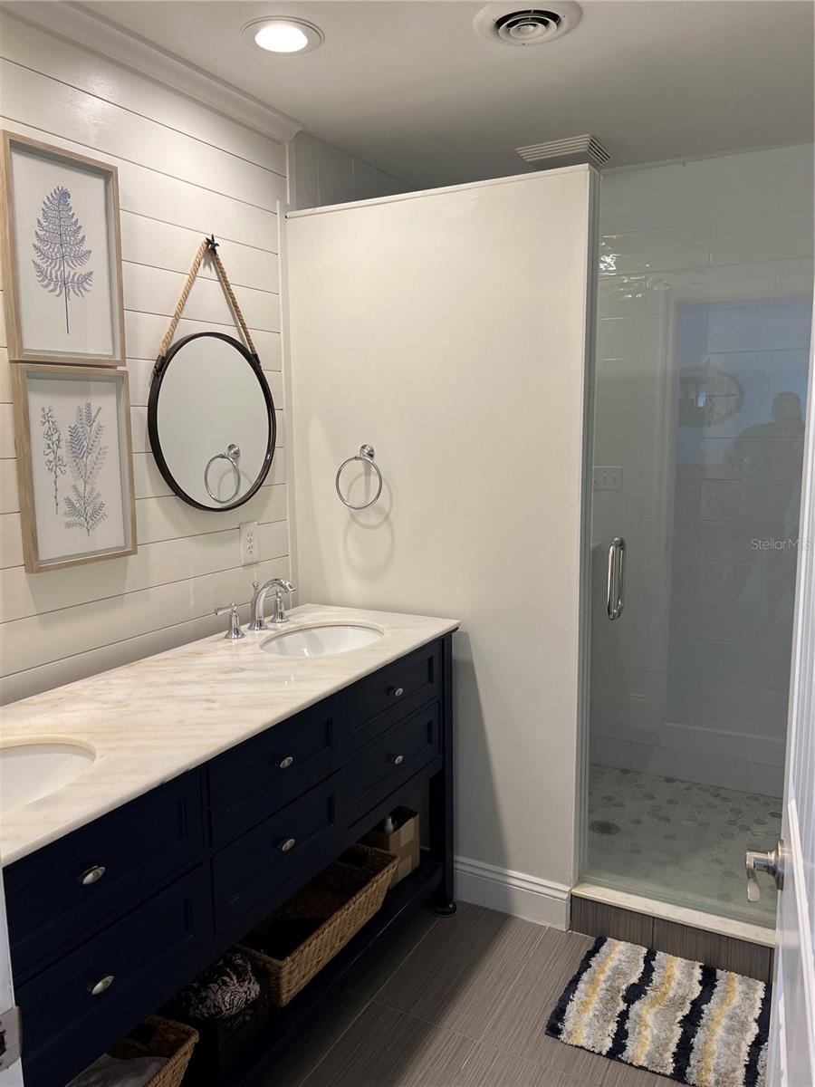 Updated en-suite master bathroom beautiful double sink vanity and stall shower.