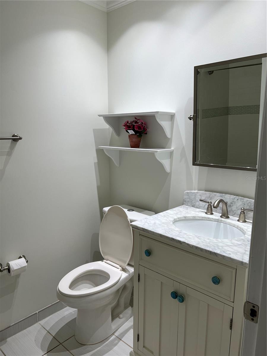 Second bath including shower with tub.