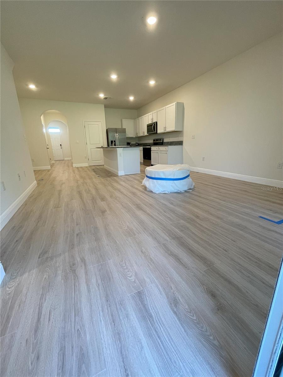 open concept kitchen, living and dining area