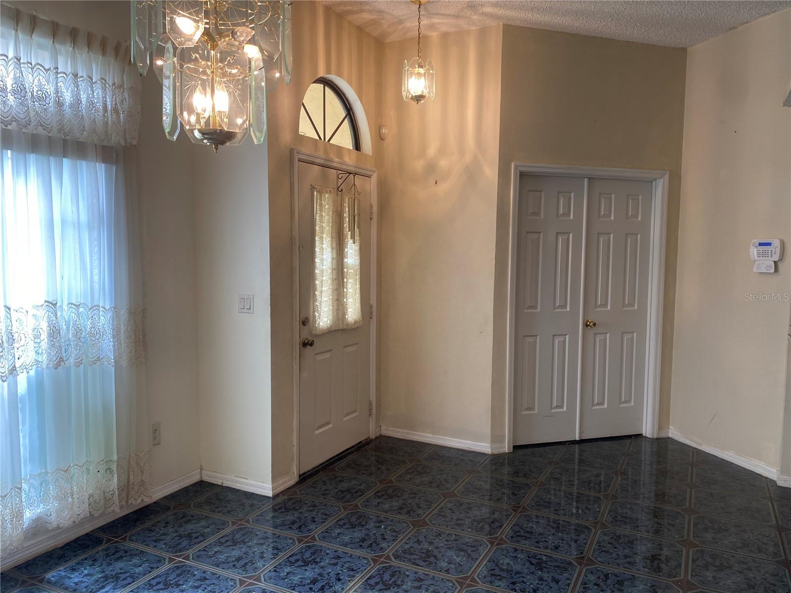 Dining room looking towards the front door and 4th bedroom or office.
