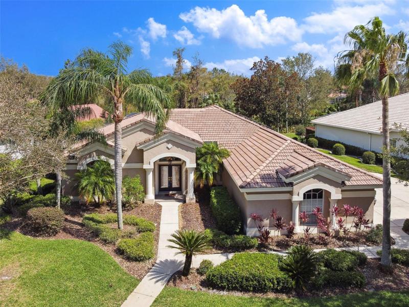 Tile roof with side entry three car garage