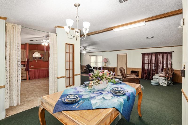 From rear (main) porch, see your kitchen, and L-shaped dining/living room area.