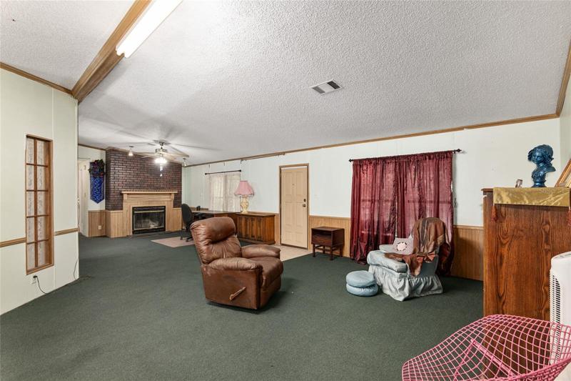 View from dining room or master bedroom,down the living room to the fireplace.