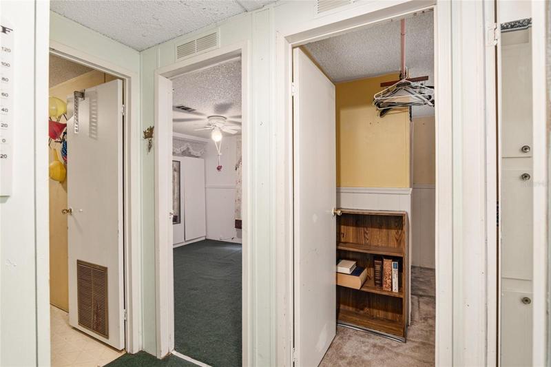 Right after living room, is Bathroom 2 on right. View from there isLaundry room on left, bedroom 2, then bedroom 3.