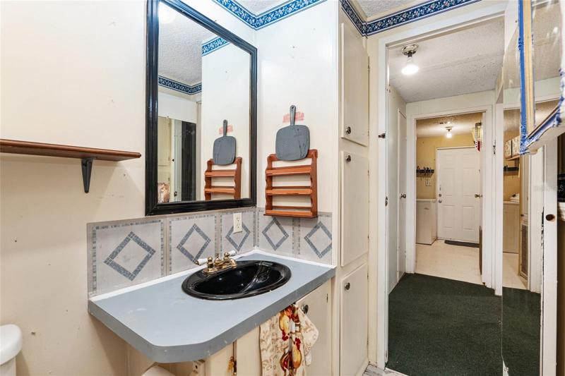 Bathroom 2, looking into Laundry Room