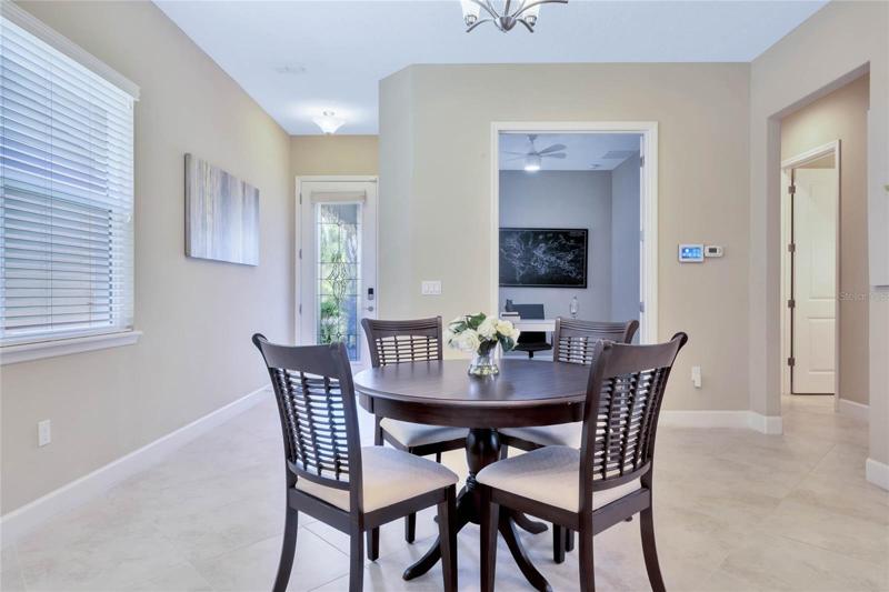 View of Dining Room & Foyer area w/ porcelain tile floors & 5