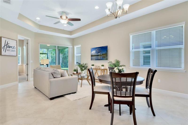 View of Great Room w/ tray ceiling, recessed lighting & flat screen TV