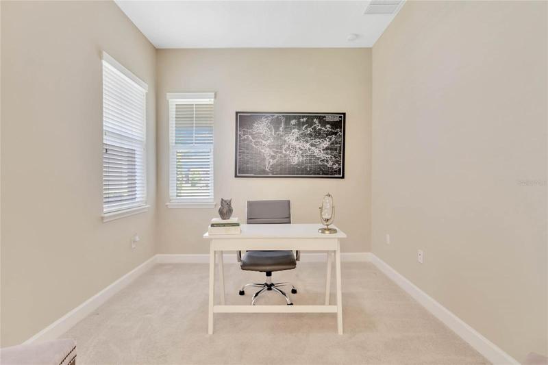 10' x 12' Den/office w/ double door entry & a ceiling fan