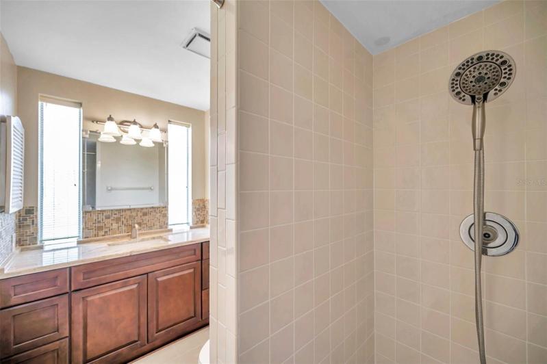 Full Ensuite Bathroom in the Primary Bedroom with large Walk-In Shower, Large Vanity, lots of natural light, renovated Cabinets, Countertops, Back Splash, Faucets, etc.