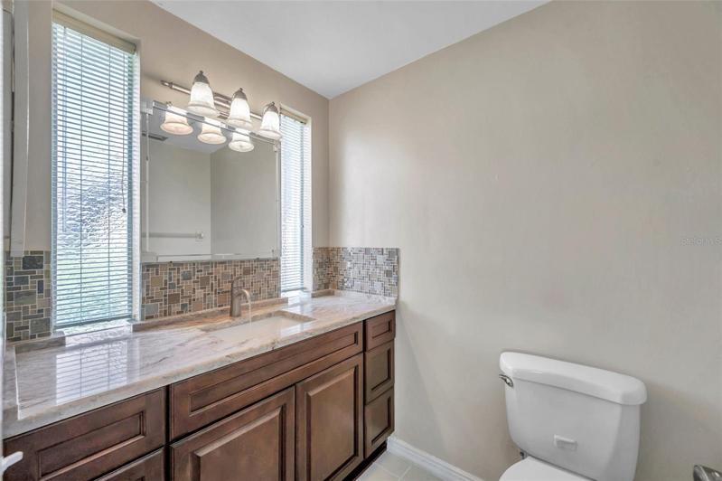 Full Ensuite Bathroom in the Primary Bedroom with large Walk-In Shower, Large Vanity, lots of natural light, renovated Cabinets, Countertops, Back Splash, Faucets, etc.