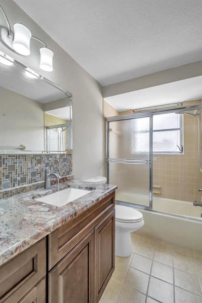 Hall Bathroom with Tile Floors, updated Vanity, Countertop, Sink, Faucet, Light, etc.