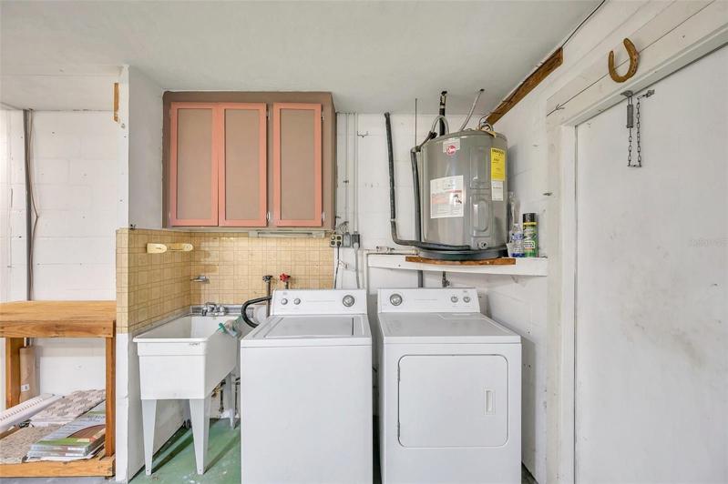 Washer and Dryer included and located in the Double Car Garage with a Utility Tub and cabinets for storage.