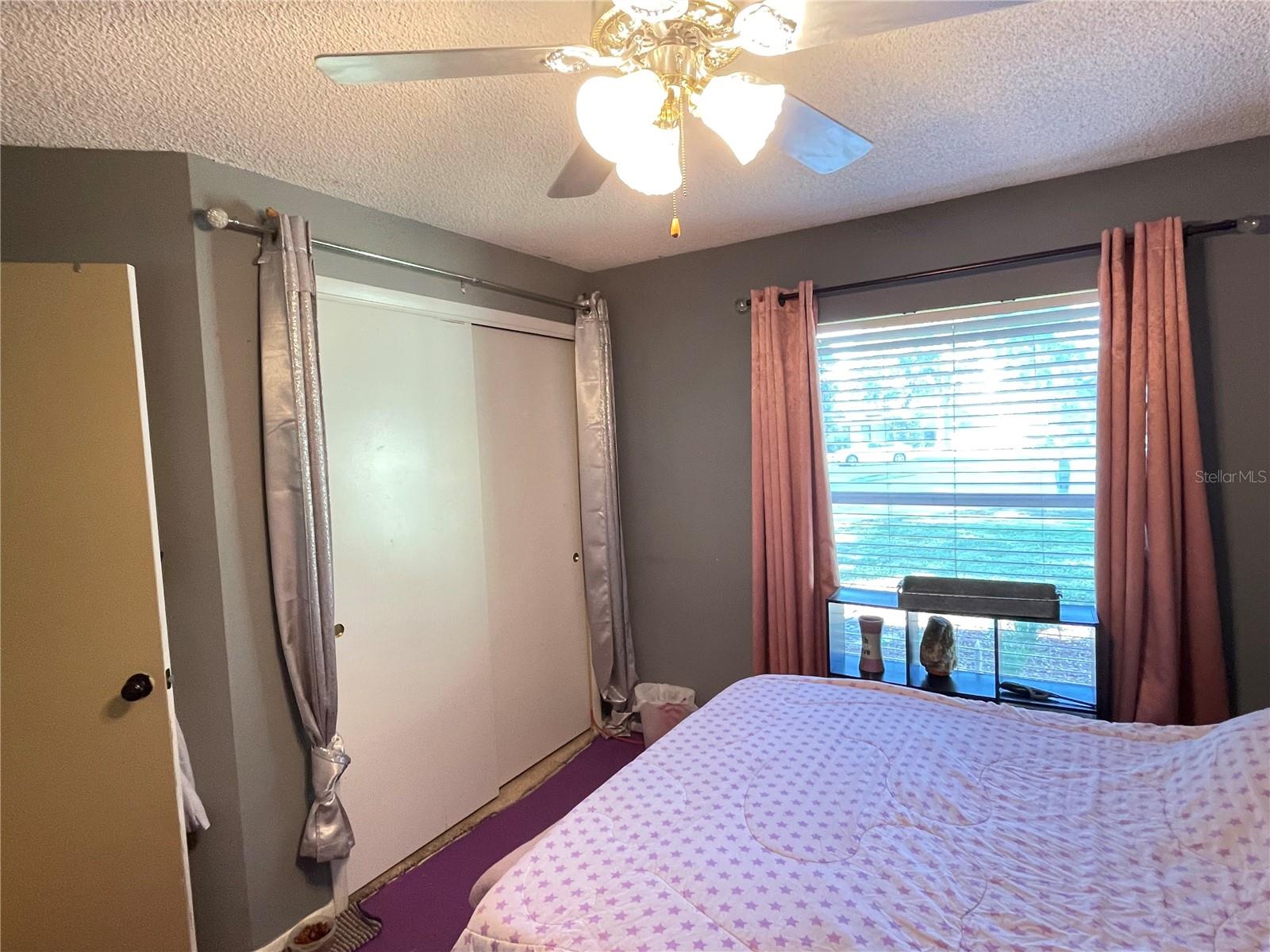 Bedroom 3 with fan off main foyer