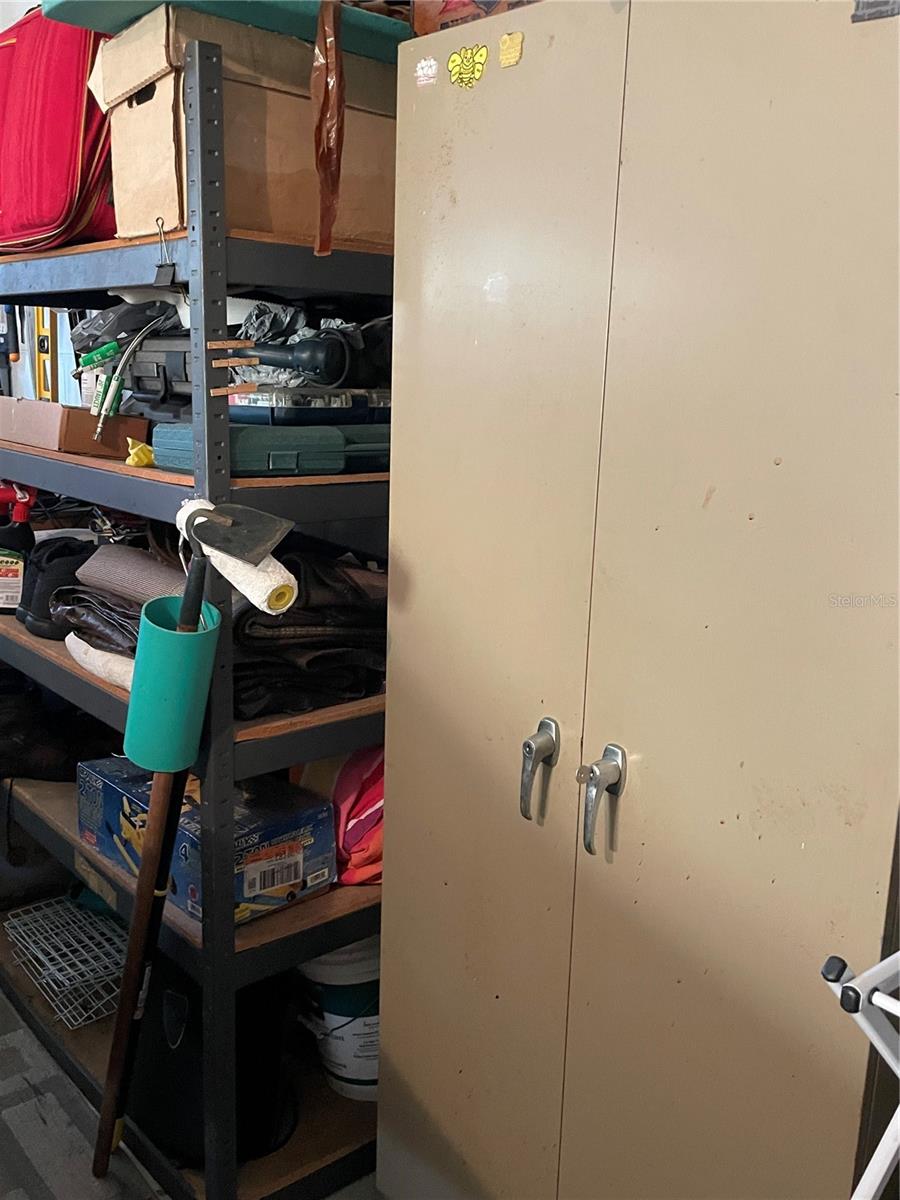 Shelving will be cleaned off. It stays as well as cabinet.
