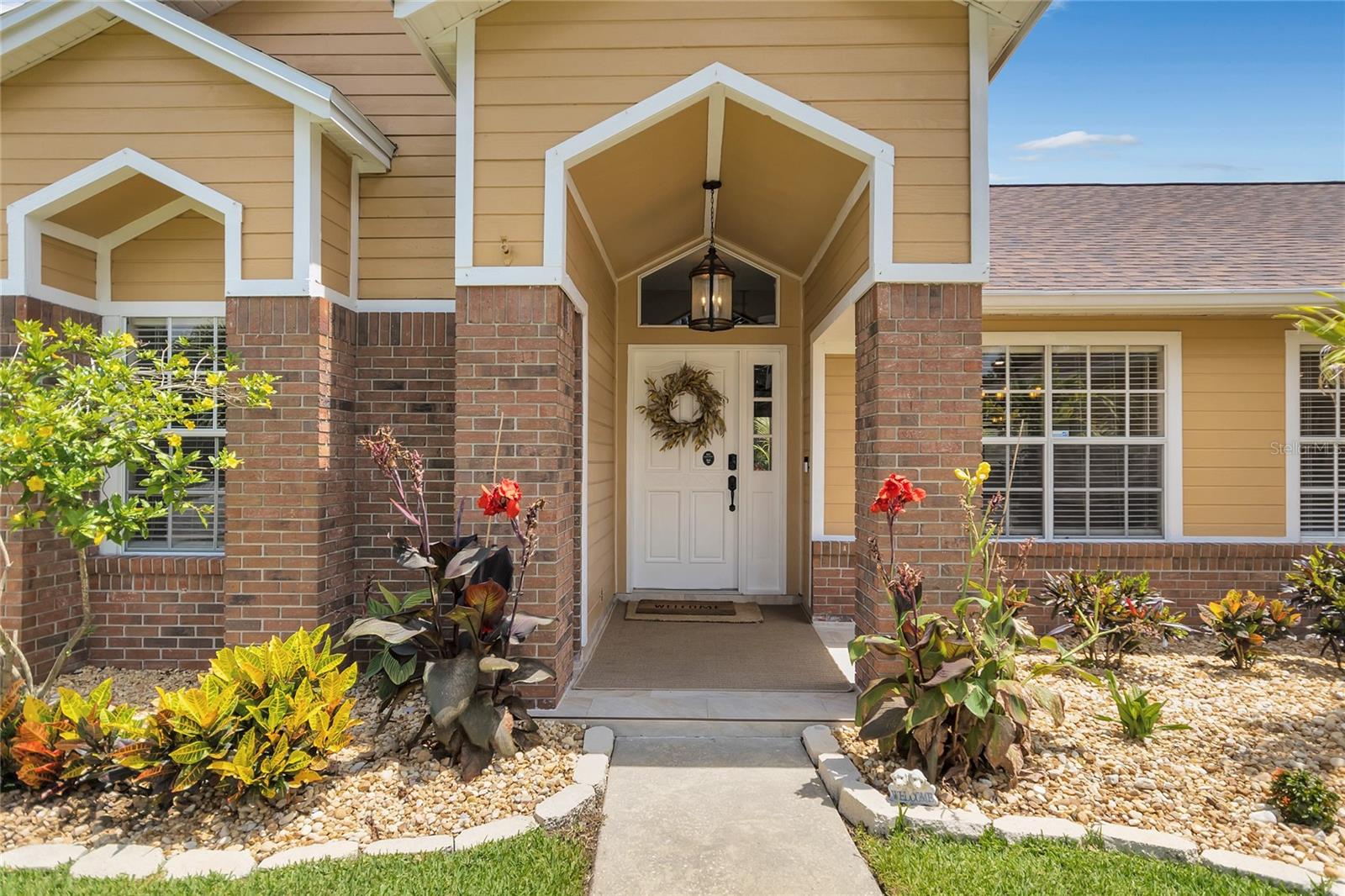 As you approach the property, you'll be greeted by beautifully updated landscaping adorned with landscape rocks.