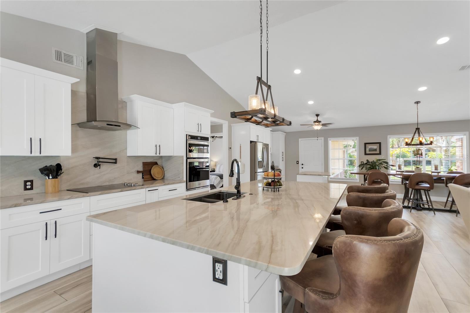 A generously-sized counter height breakfast bar adds convenience and functionality.