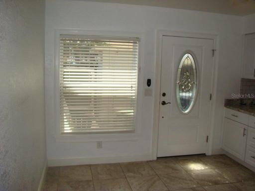 Eat in kitchen to new back door leading to patio