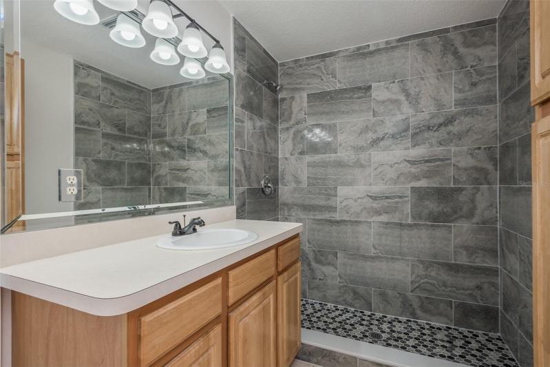 Primary bathroom with all new shower pan and walls and fixtures
