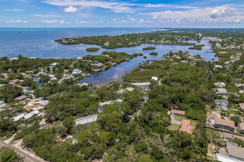 Canal behind the home leads to Sutherland Bayou and out to the Gulf