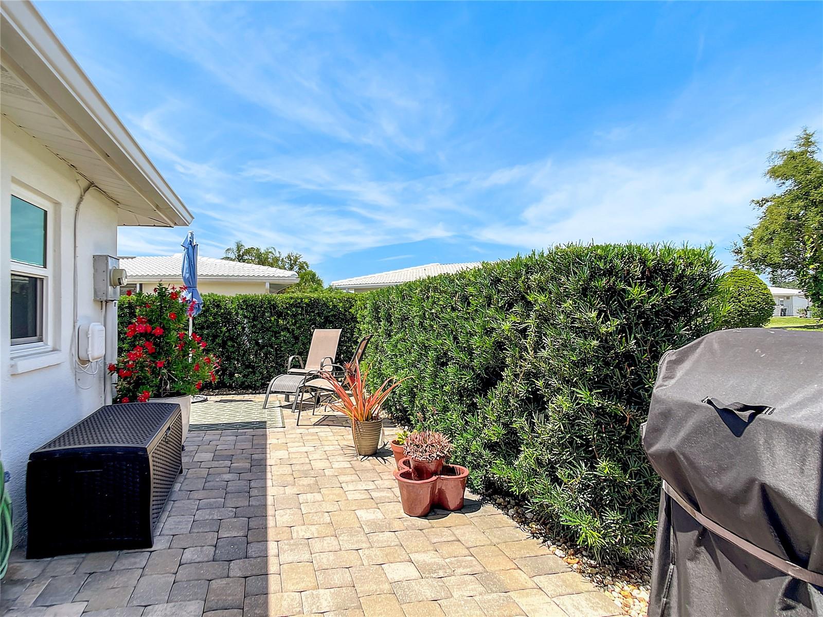 Wonderful outdoor patio with paver stone to match the decorating of the exterior.