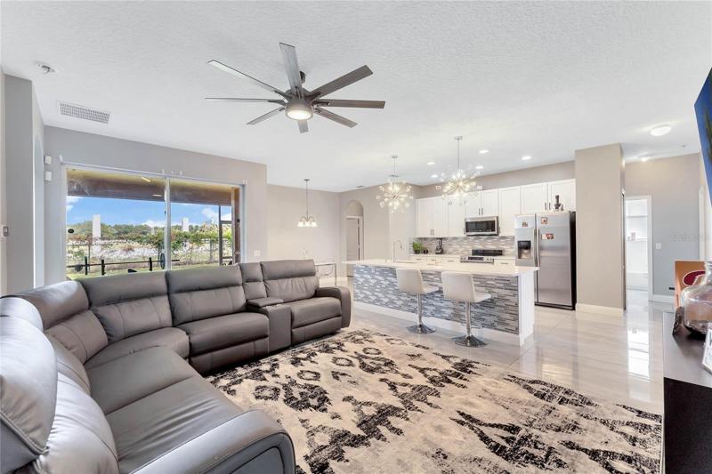 The kitchen is open to a casual dining space and family room with sliding glass doors that access the 15x13 SCREENED LANAI!