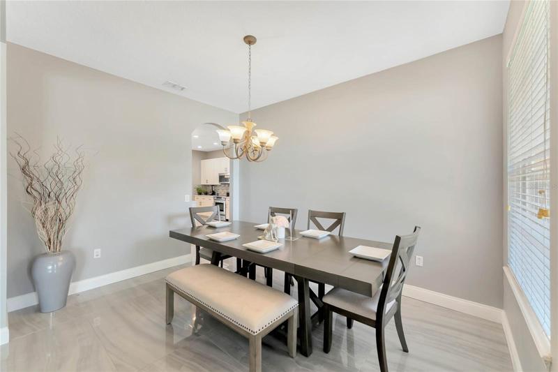 TILE and VINYL PLANK FLOORS in all the main living areas make maintenance a breeze and add to the bright open feel, starting in the formal (or flex!) spaces where you can entertain friends and family or create something unique to you!