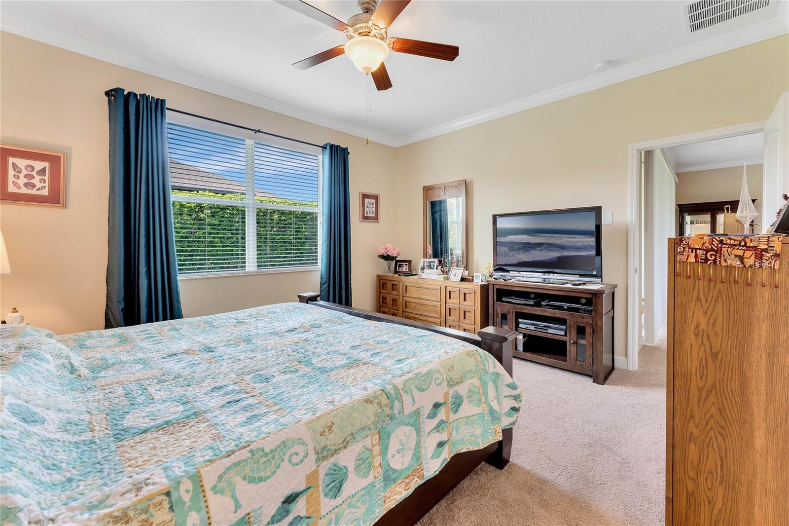 Master Bedroom Suite offers a large Walk in Closet &amp; views of the Backyard