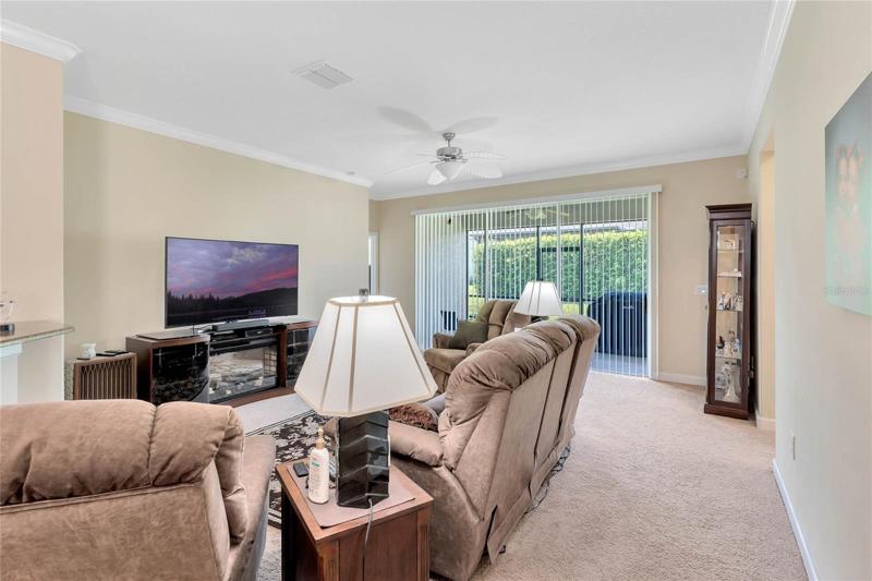 Great Room is Enhanced w/ Oversized Glass Sliding Doors allowing access to the Covered Lanai
