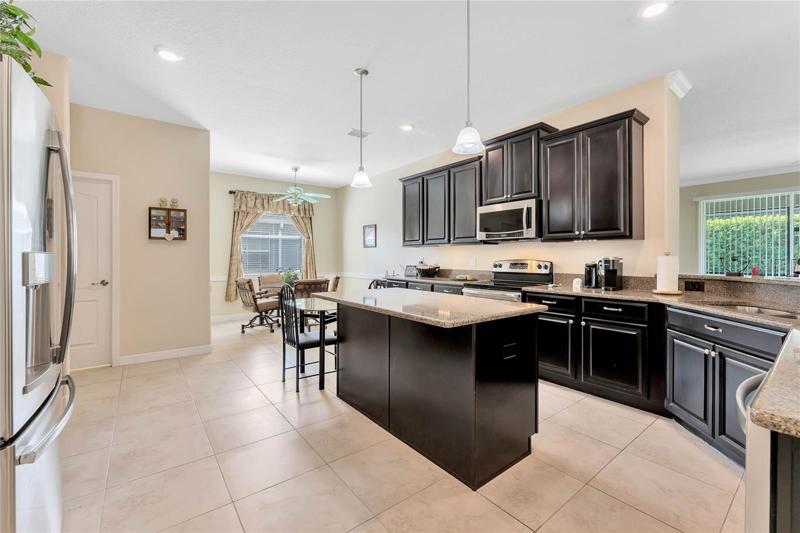 Center Island Features Pendent Lighting & Quartz Countertops