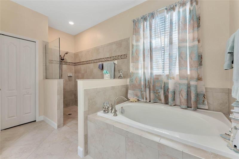 Master Bathroom offers a Garden Tub, Handicap Accessible Tiled Shower & Linen Closet