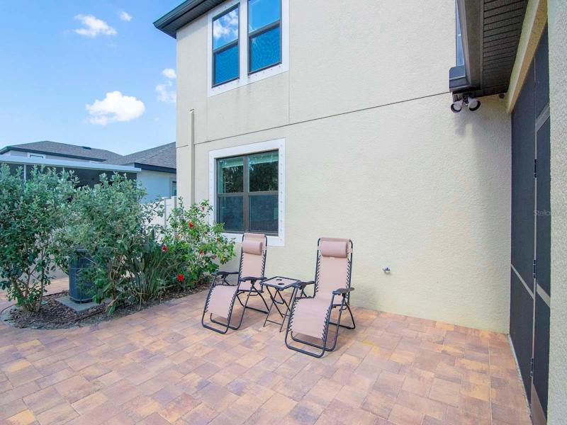 Pavered outdoor area and still plenty of green space