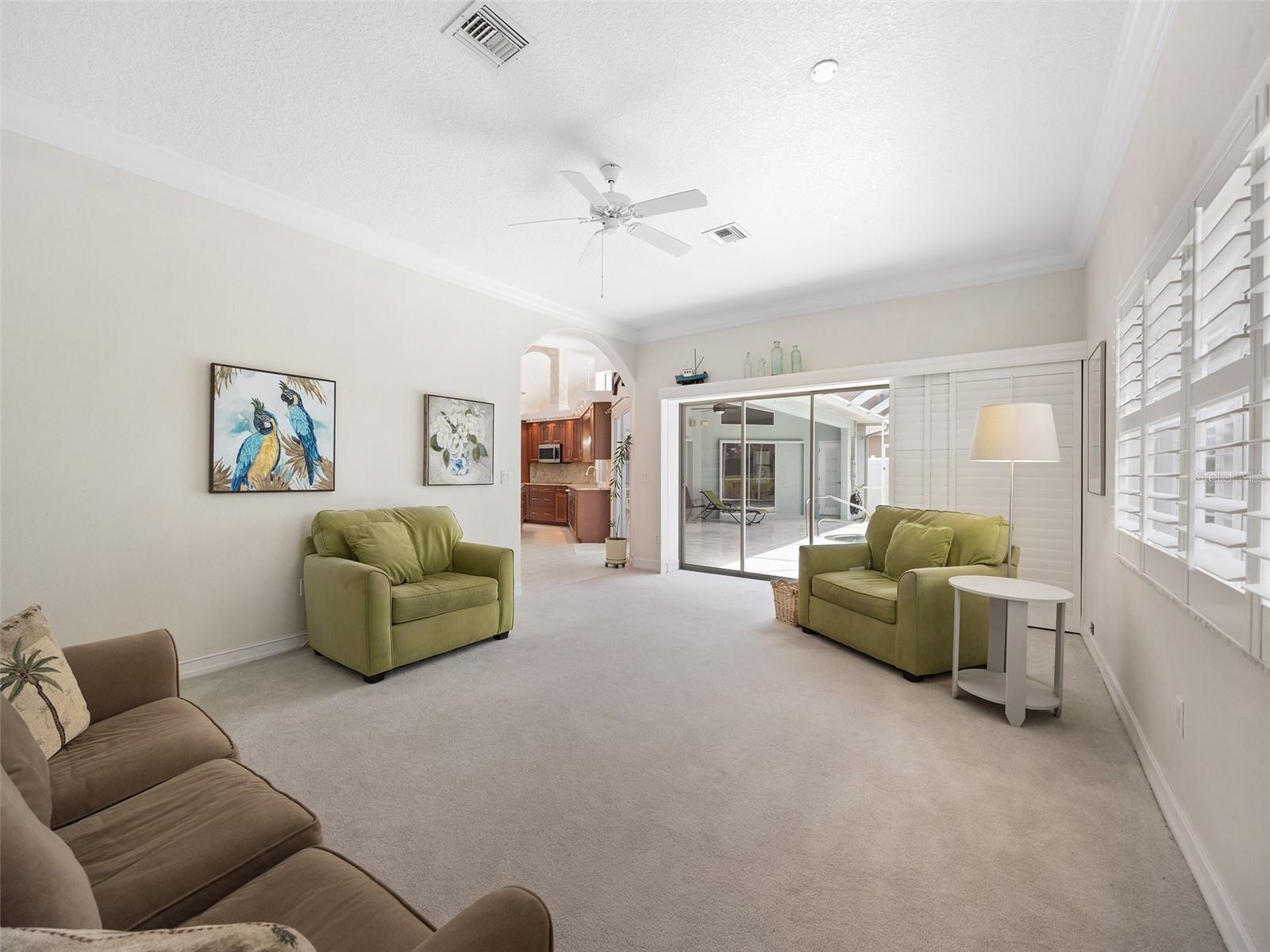 Main living room with Plantation Shutters and sliding door