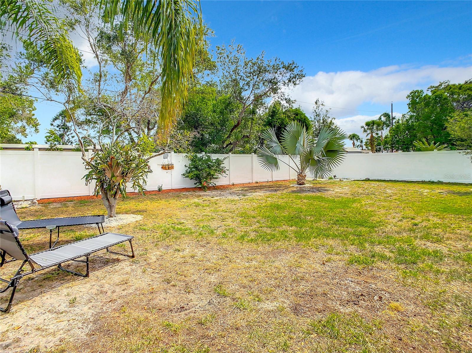 Backyard oasis has plenty of room for a pool