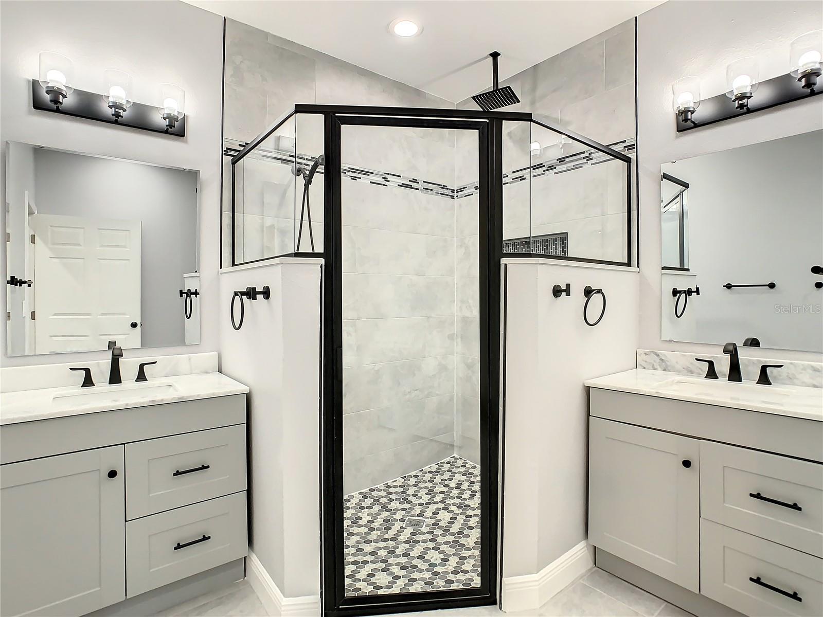 Master bathroom. Granite on counters upgraded cabinets and tile in shower.