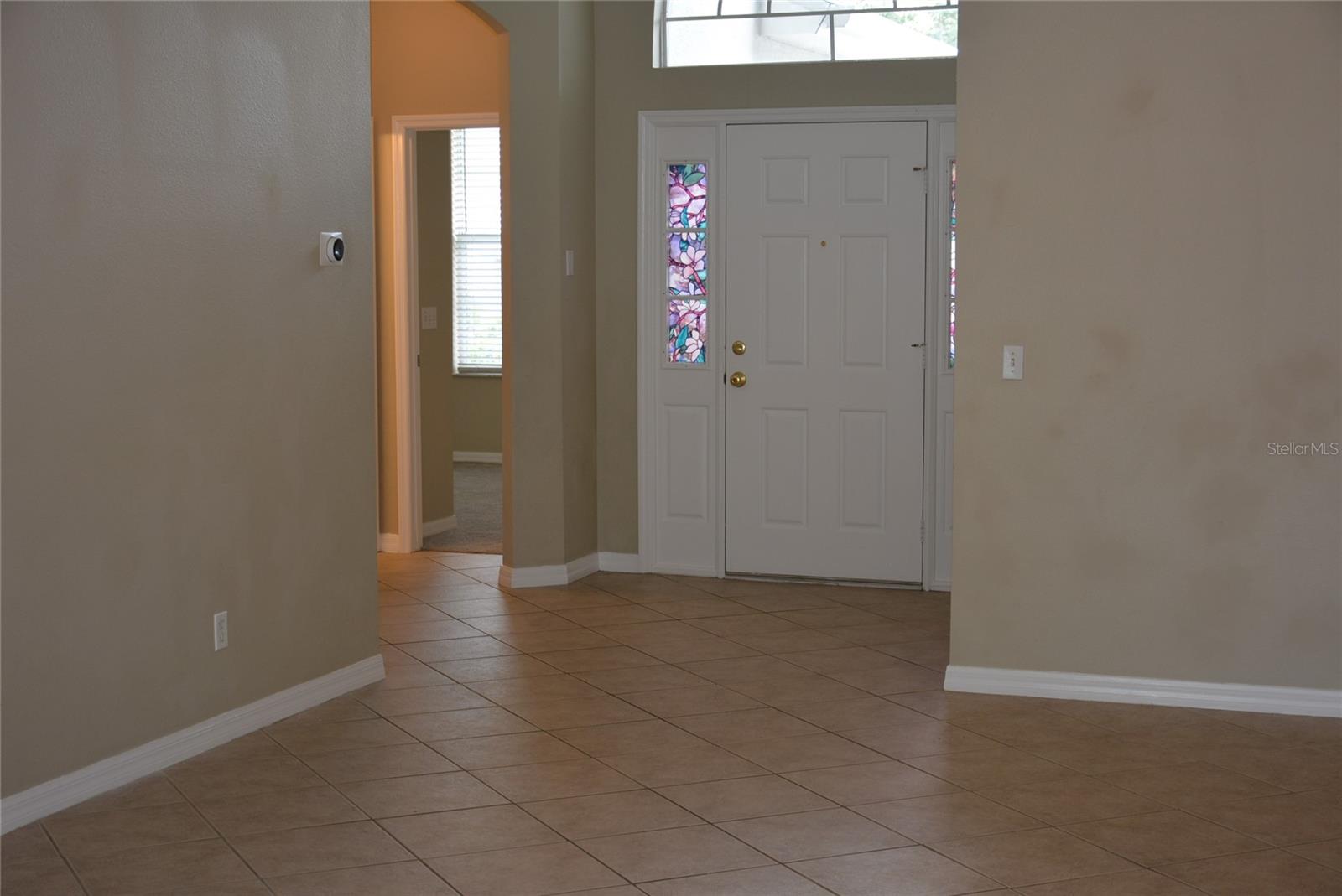 Tile floors in all the living and wet areas with nine foot ceilings throughout the home