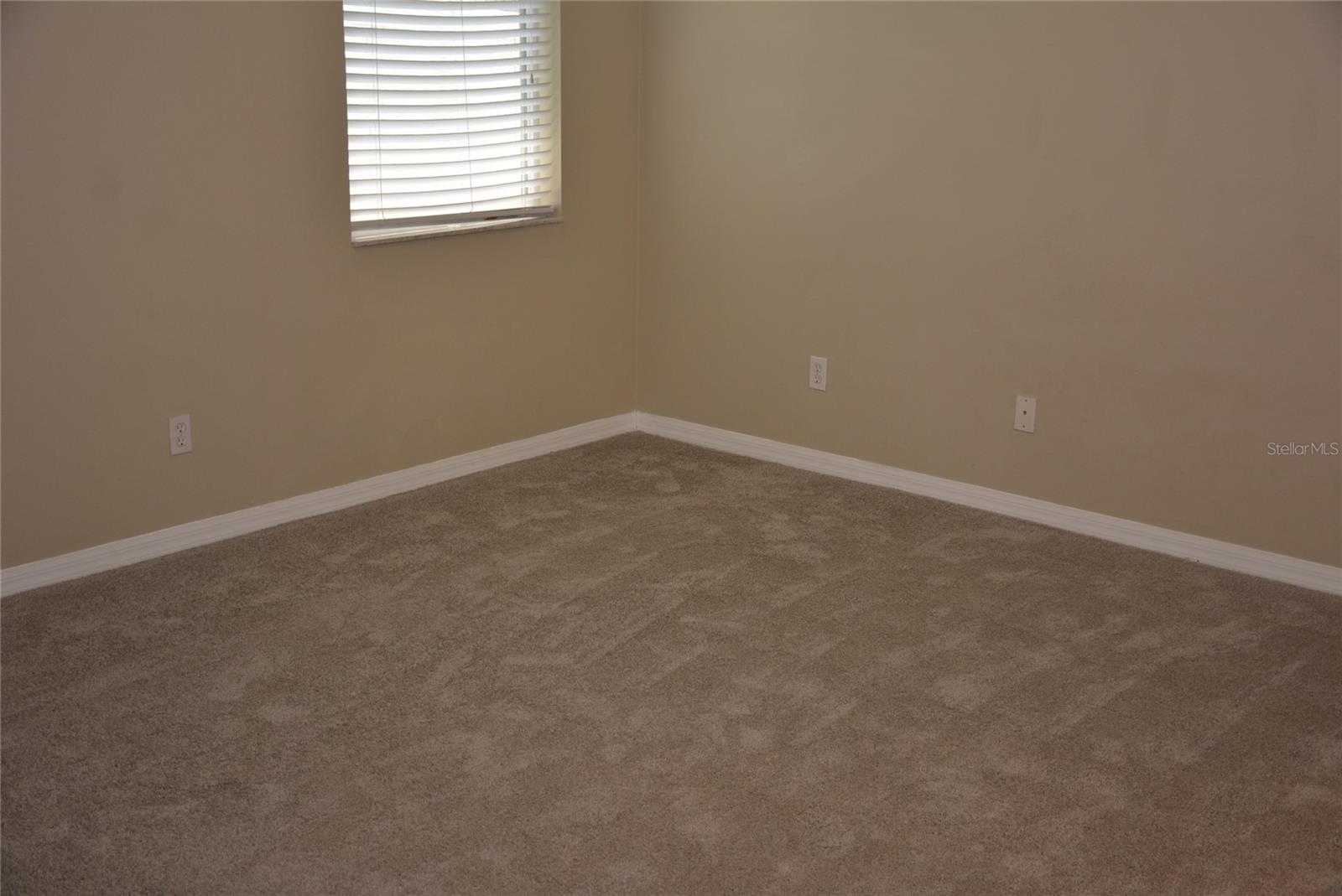Spacious master bedroom and bath with double vanity, garden tub, step-in shower with dual showerheads, walk-in clothes closet and private water closet.. Brand new carpet and pad.