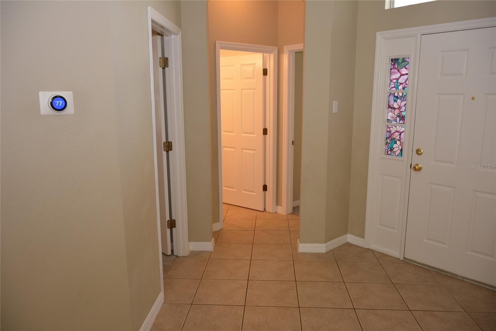 Guest wing off the foyer has bedrooms 2 and 3 as well as the guest bath