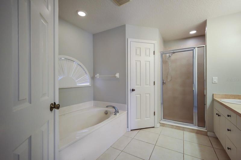 Primary bathroom with soaking tub and separate shower