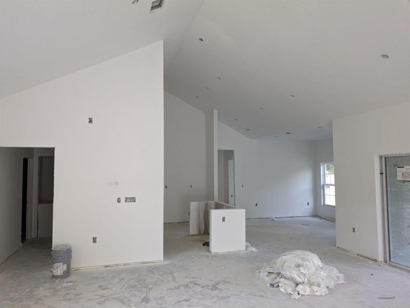 Cathedral ceiling in the kitchen and living area. Actual house under construction.