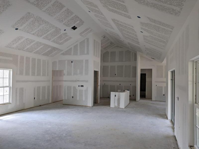 Cathedral ceiling in the kitchen and living area. Actual house under construction.